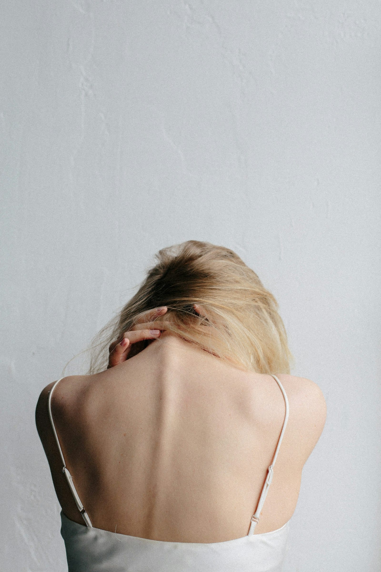 Person holding their neck after injury