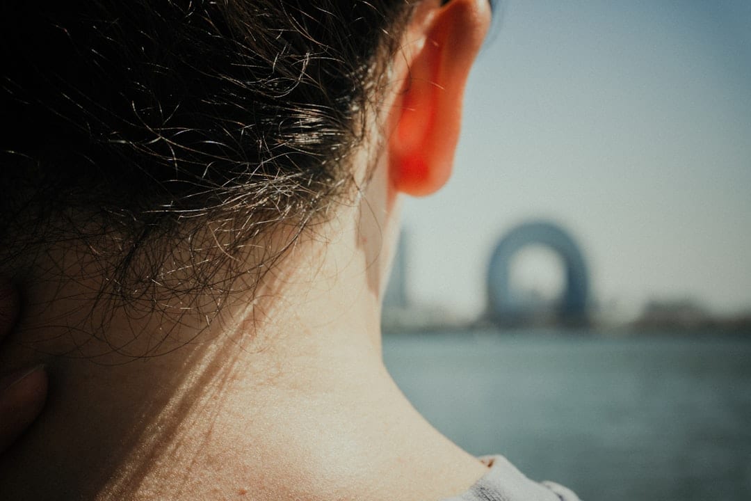Close-up of the back of a person's neck and upper cervical spine area, illustrating the region targeted by Atlas Orthogonal upper cervical care for TMJ disorder relief.