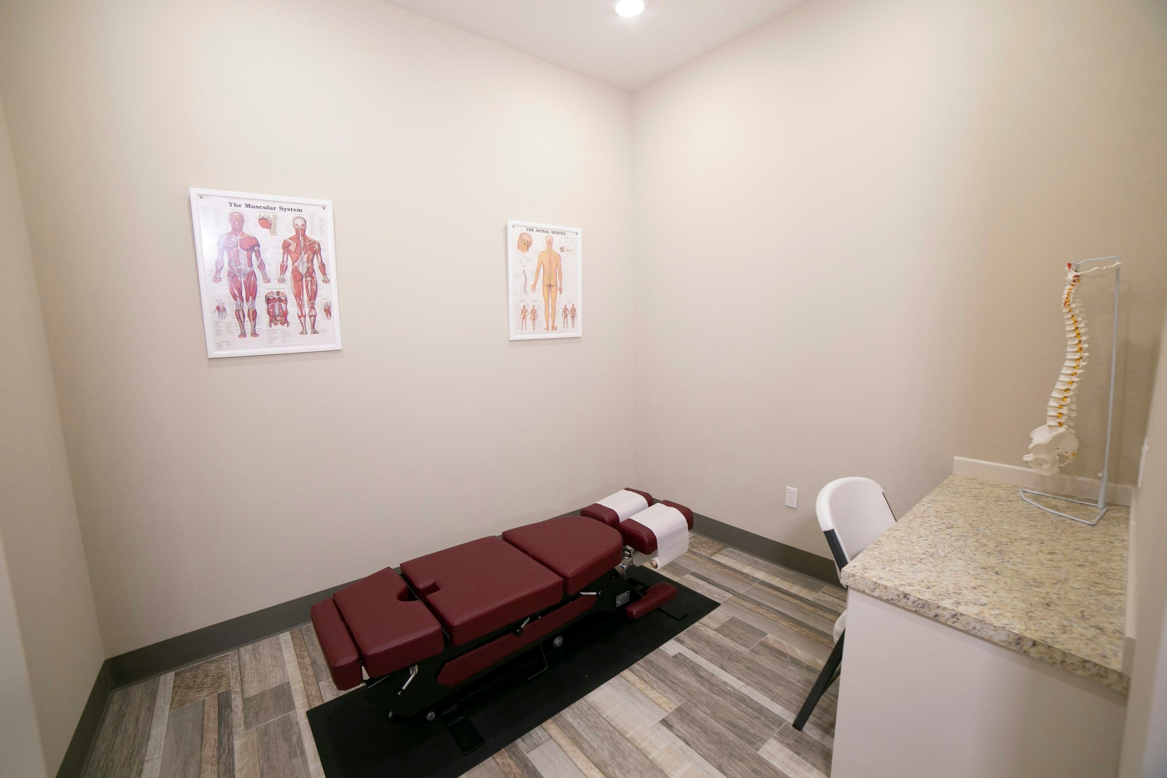 A calm, private treatment room at Atlas Injury to Health, set up for gentle upper cervical care and SoftWave therapy sessions.
